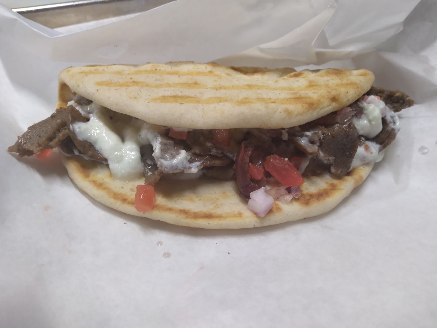 Greek gyro on grilled flatbread